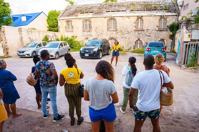 Historical Guided Walking Tour of Marigot by ISLAND FRIEND - Rue de la Liberté: movies, repurposed buildings, and hurricane scars