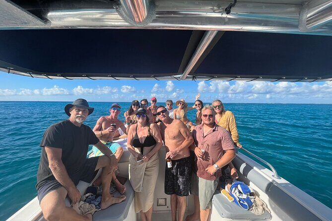 Private Boat Charter St Maarten / St Martin - Pinel Island: beach restaurants, shallow water, and friendly iguanas