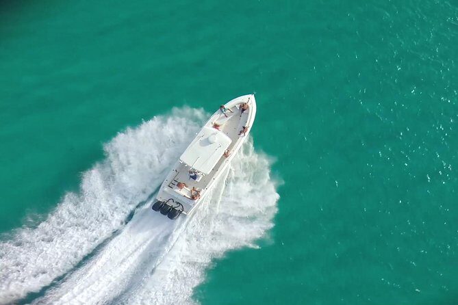 Speed Boat & Snorkeling Tour Pinel & Tintamarre Islands for CRUISE SHIP GUESTS - La Samanna fish-feeding, mansions, and red cliffs from the water